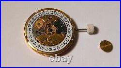 GENUINE ETA 2824 movement yellow, runs. For watch repair or parts