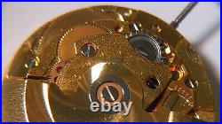 GENUINE ETA 2824 movement yellow, runs. For watch repair or parts