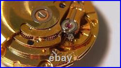 GENUINE ETA 2824 movement yellow, runs. For watch repair or parts